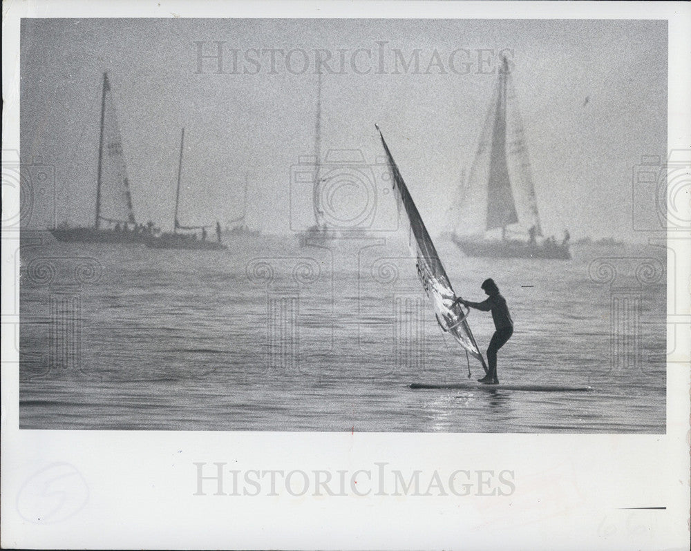 1978 Press Photo A kid on a surfboard and sailboats - Historic Images