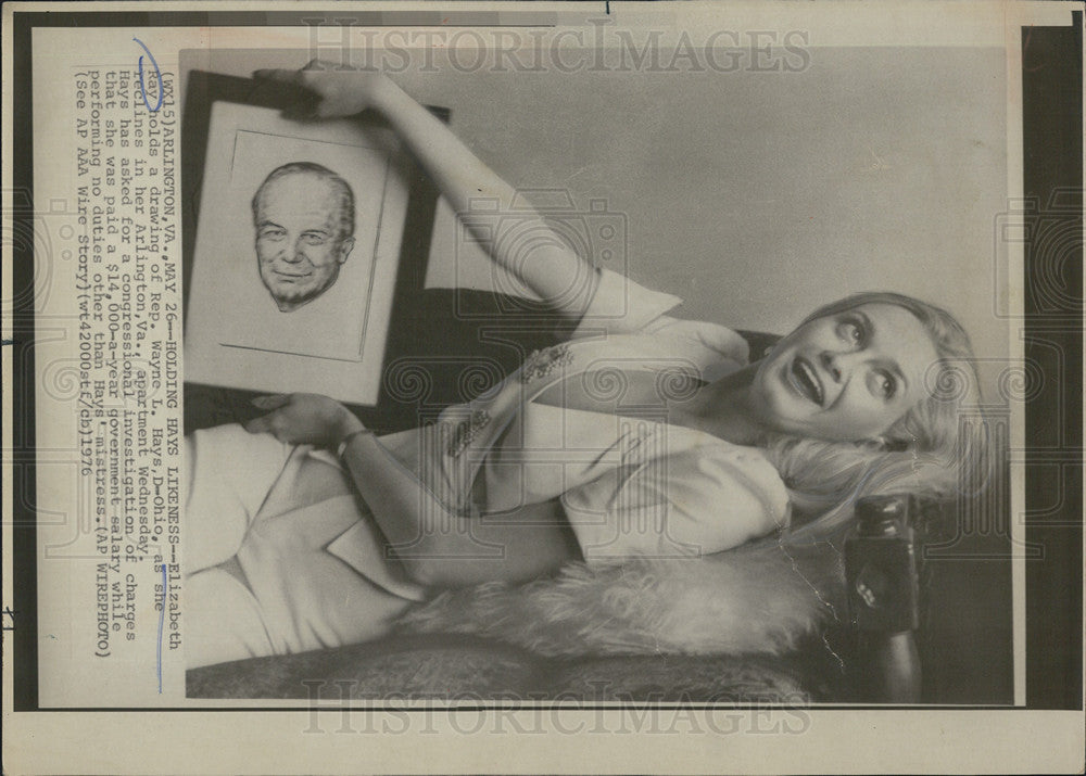 Elizabeth Ray Holds drawing of Rep. Wayne L. Hays 1976 Vintage Press