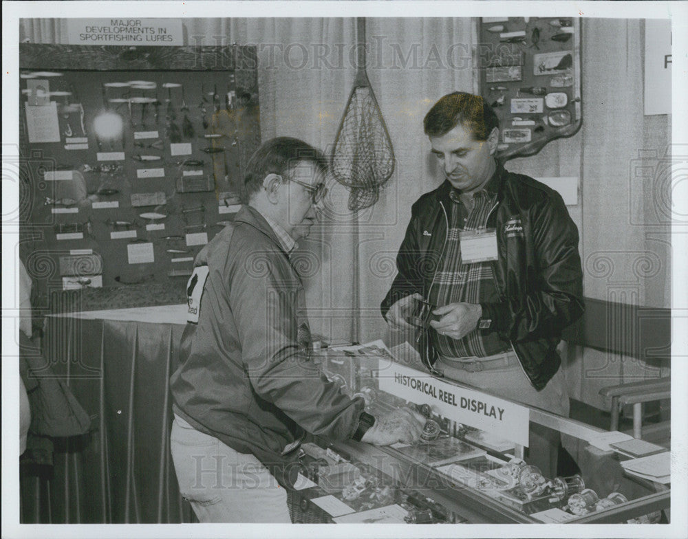 1988 Press Photo Displaying fishing equipment at the Chicagoland Sport Fishing, - Historic Images