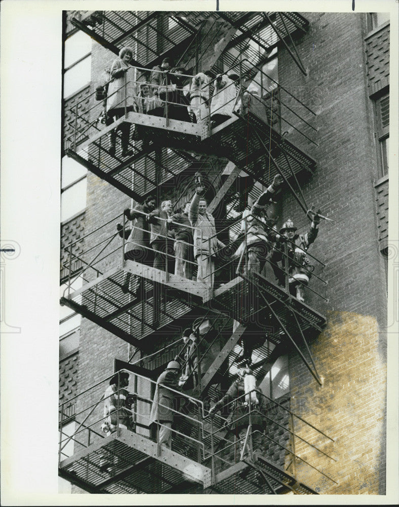 1984 Press Photo Firefighters Help People Down Fire Escape At 65 E South Water - Historic Images