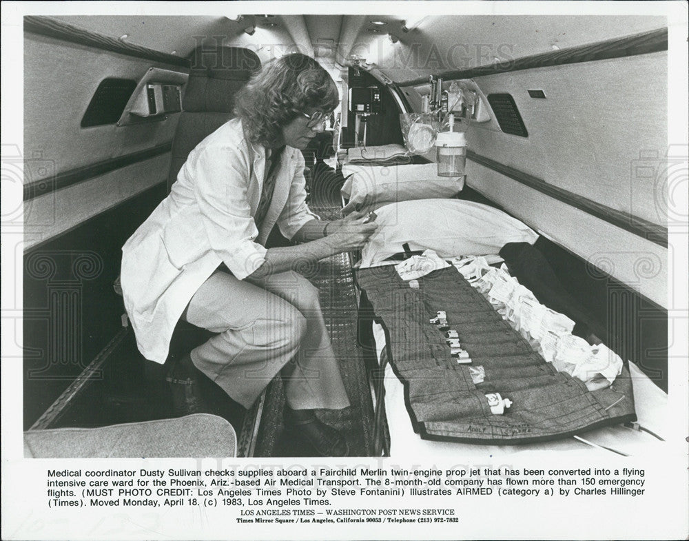 1983 Press Photo Stocking medical supplies on a Fairchild Merlin twin engine - Historic Images