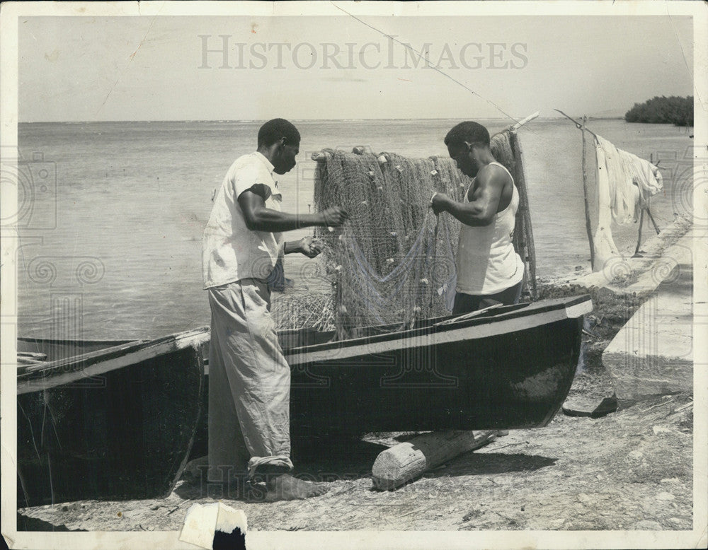 Getting fishing nets ready to do some Jamaica fishing 1959 Vintage Press  Photo Print - Historic Images