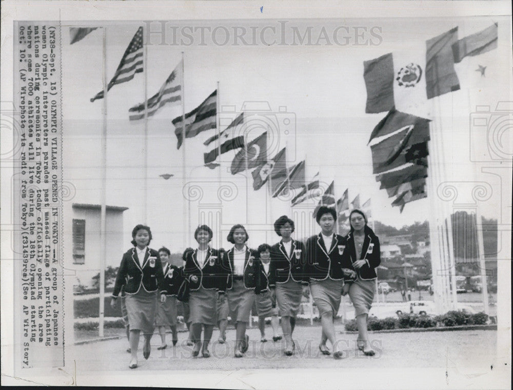 Press Photo Japanese women Olympic interpreters parade past during Olympiad - Historic Images
