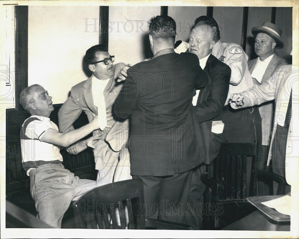 1958 Press Photo James Prucha Sr. dodges his sister-in-law&#39;s blows - Historic Images