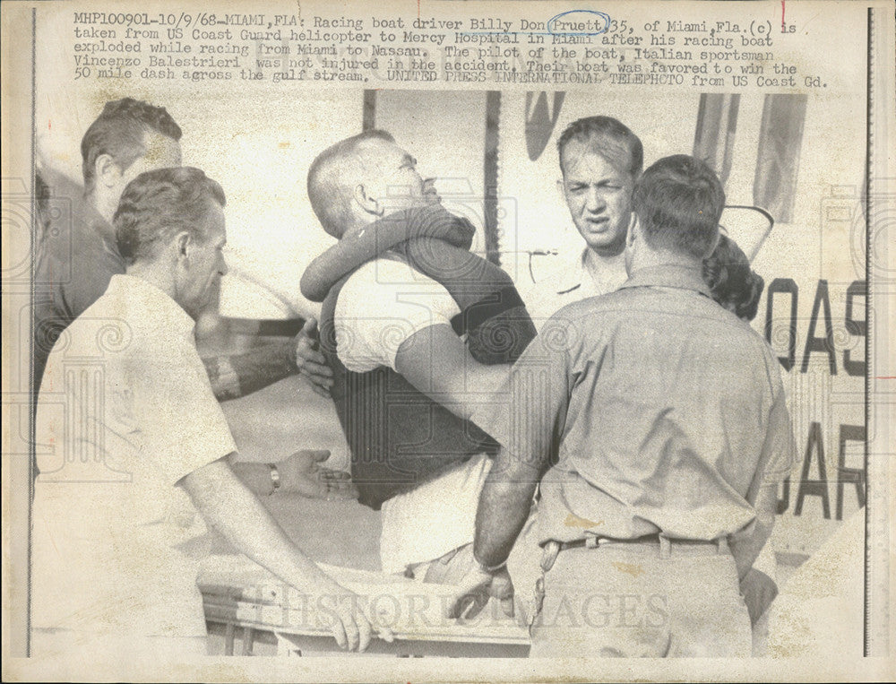 1968 Press Photo Driver Billy Pruett taken by a coast guard to the hospital. - Historic Images