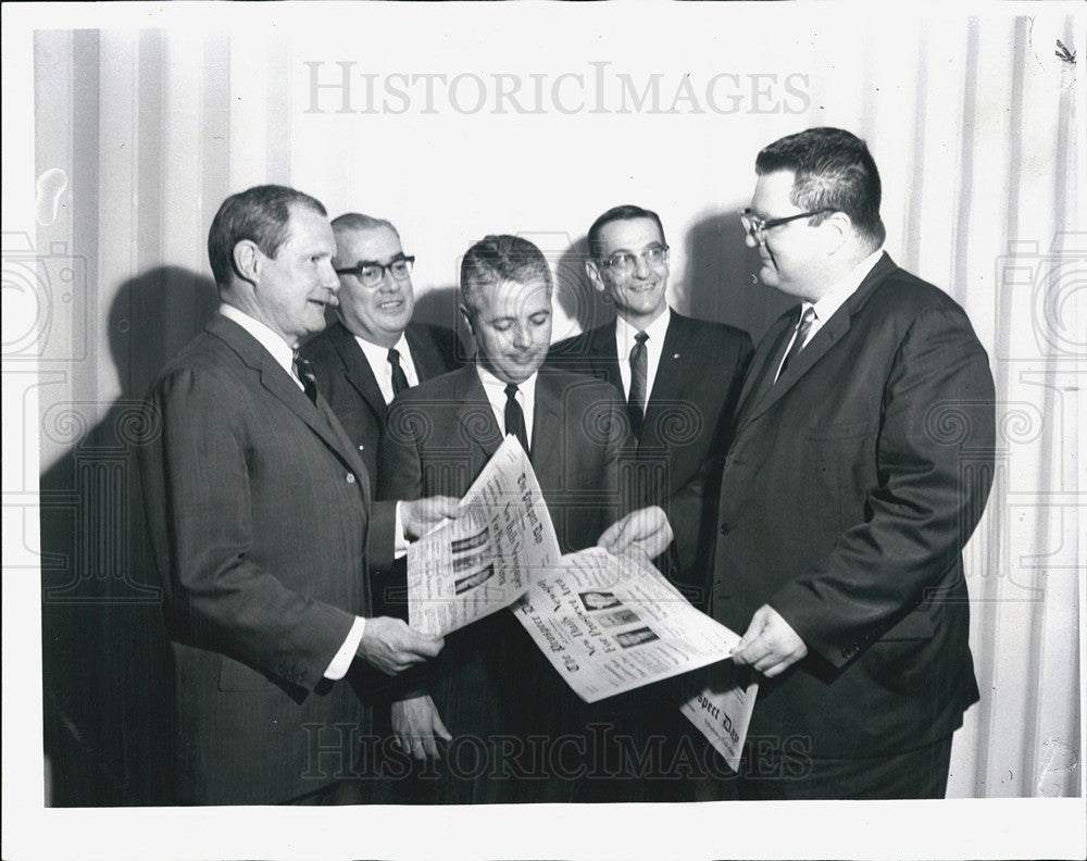 1966 Press Photo John Stanton, President of Day Publications, Inspects New Paper - Historic Images