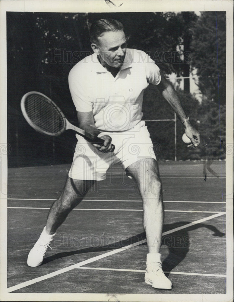 1958 Press Photo Gen. Maxwell D. Taylor gets in a game  of tennis. - Historic Images