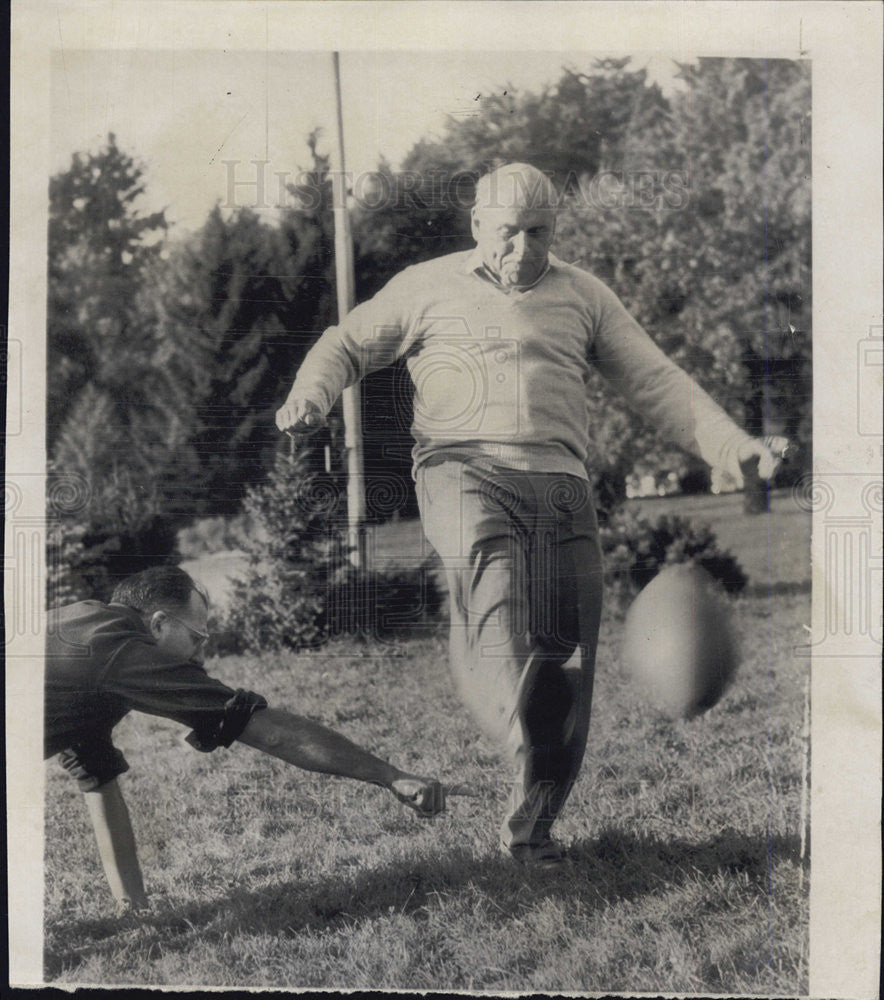 1951 Press Photo John J. McCloy, US High Commissioner plays football. - Historic Images