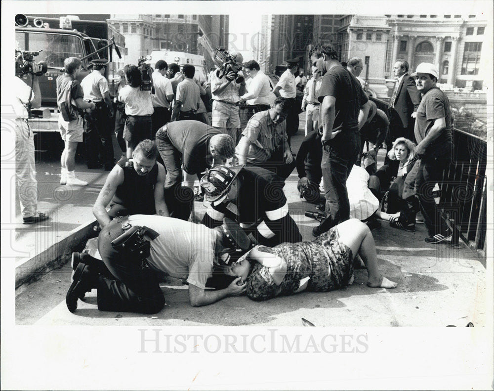 1991 Press Photo Taxi Out of Control Struck Pedestrians, One Shown Here - Historic Images