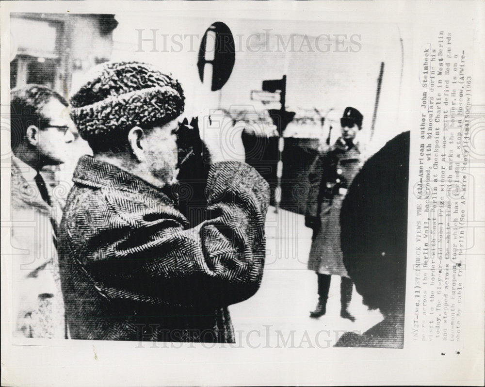 1963 Press Photo Author John Steinbeck Looks Across Berlin Wall Checkpoint - Historic Images