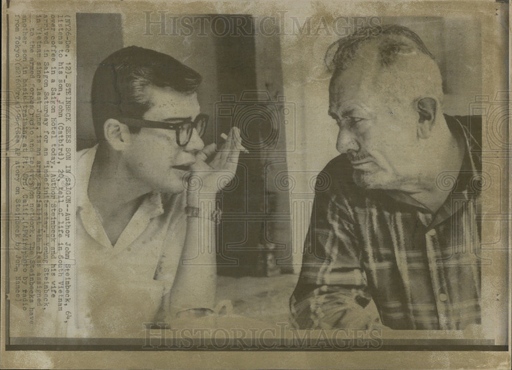 1966 Press Photo author John Steinbeck listen to his son. - Historic Images