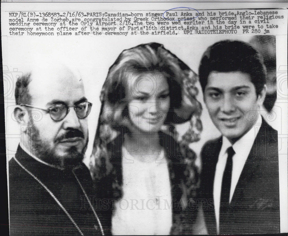 1963 Press Photo Singer Paul Anka and wife Anne,congratulate  by Greek Orthodo. - Historic Images