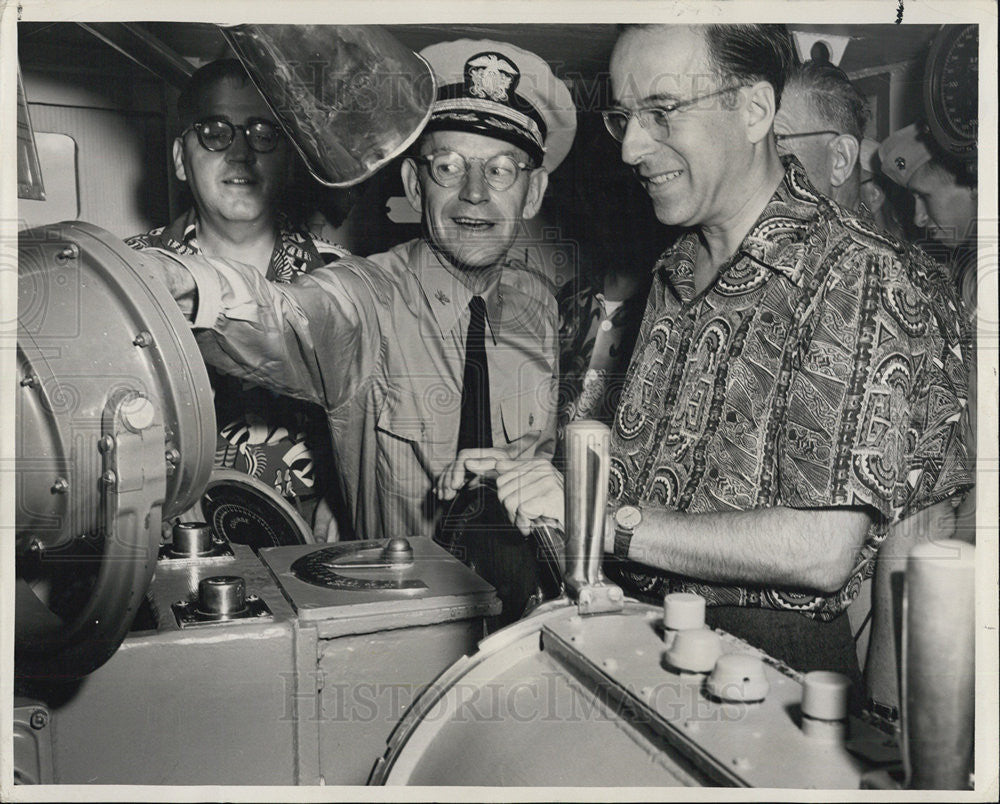 1953 Press Photo Buisnessman and Commander at helm of the U.S.S. Toledo - Historic Images