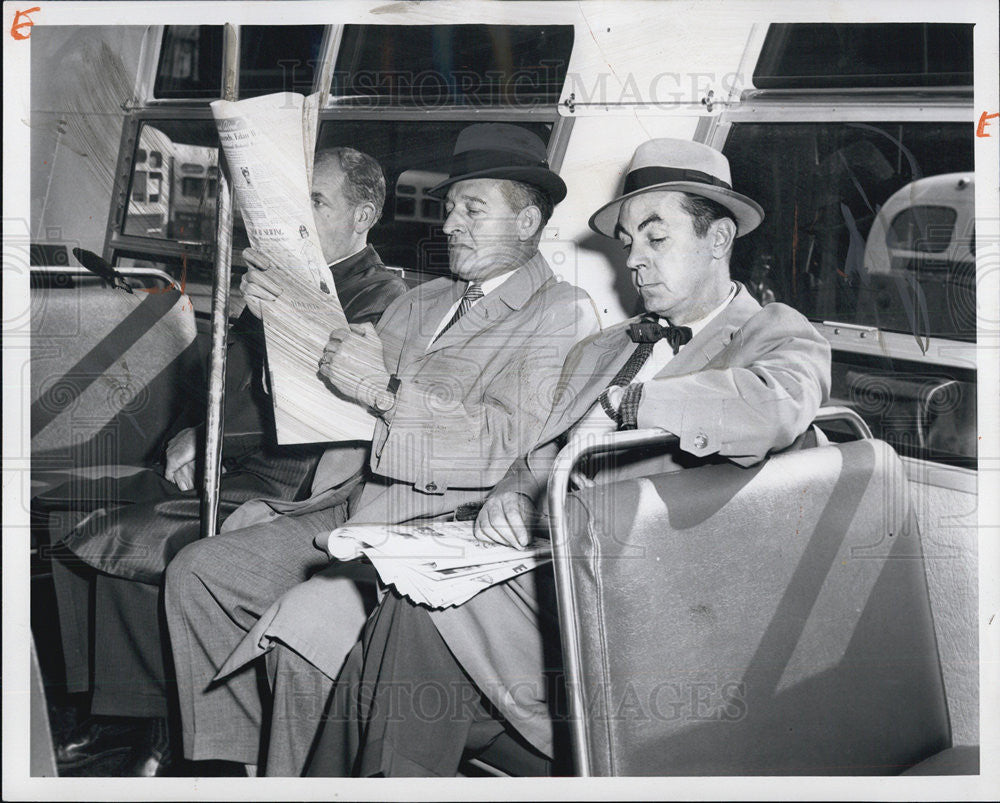 1961 Press Photo Two Men holds a newspaper while on the Bus - Historic Images