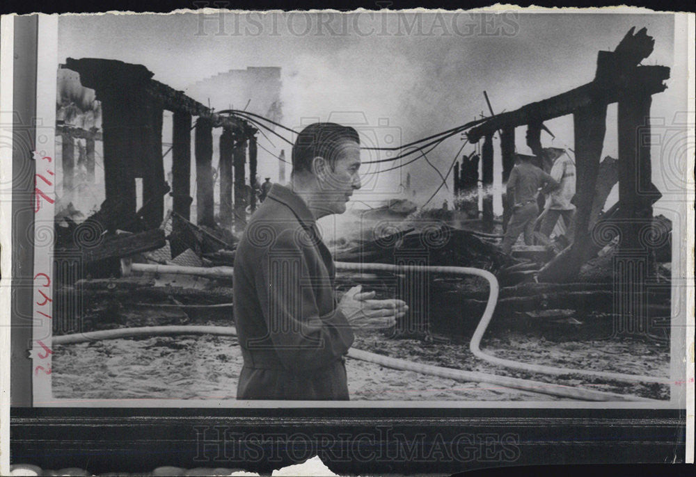 Press Photo Man Looks At Building Remains After Fire - Historic Images