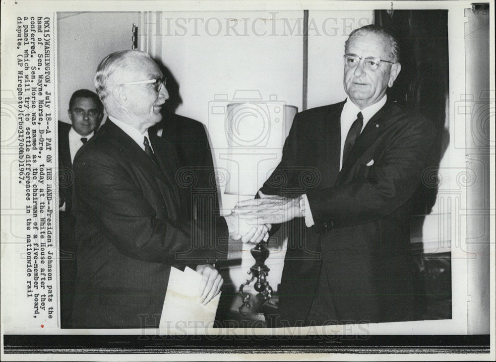 Pres Johnson pats the hand of Sen Wayne Morse at the White House 1967 ...