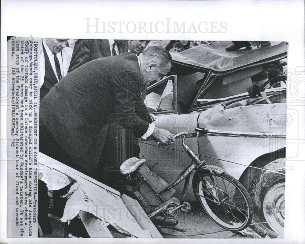 1965 Press Photo President Johnson Picks up Child&#39;s Bike After Tornado - Historic Images