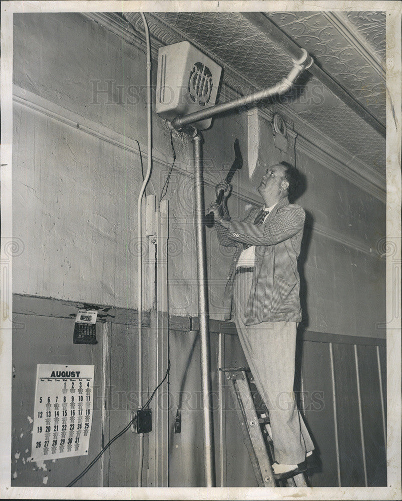 1951 Press Photo Policeman Removes Speaker after Gambling Raids - Historic Images