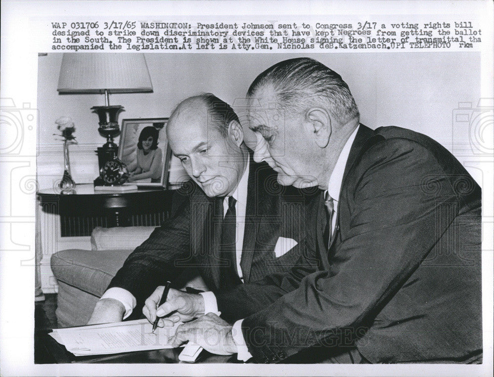 1965 Press Photo President Johnson is shown signing a letter of transmittal. - Historic Images