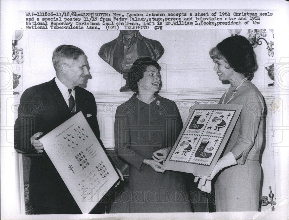 1964 Press Photo Mrs.Johnson accepts a sheet of 1964 Christmas Seals and Poster. - Historic Images