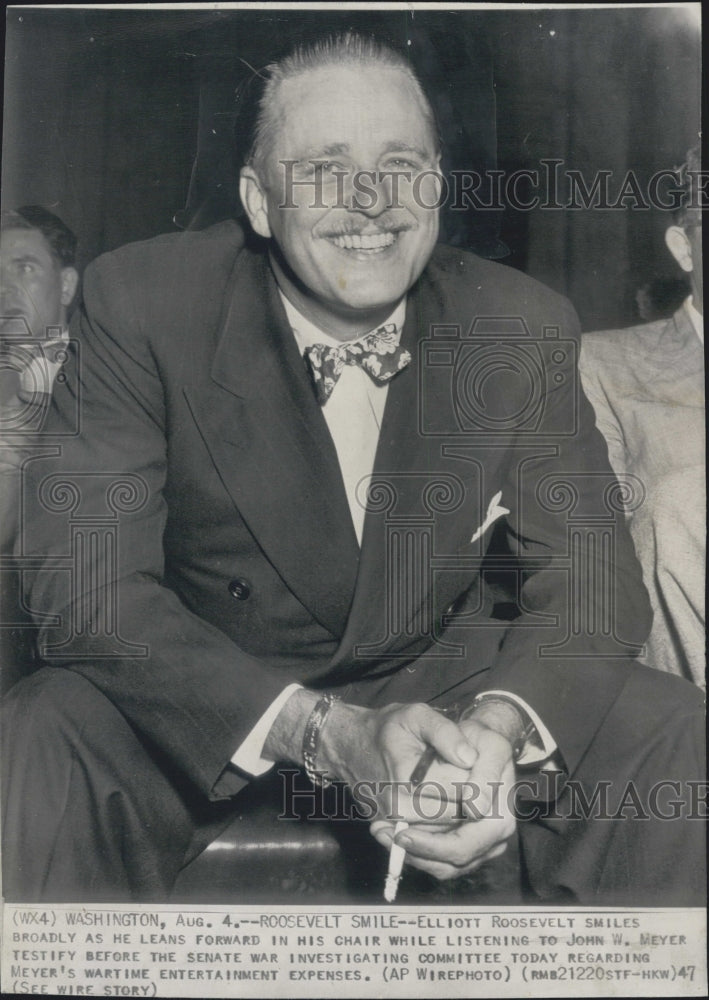 1947 Elliott Roosevelt listens to John Myer testify - Historic Images