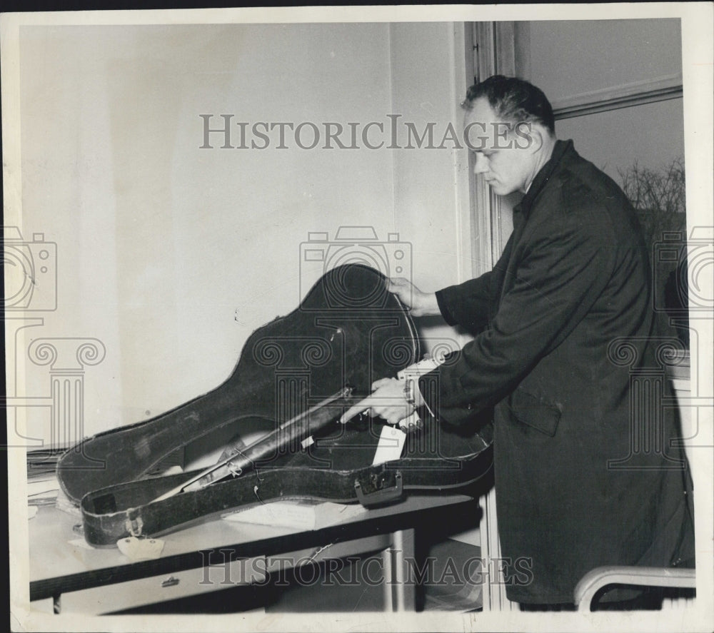 1964 George Ross displays rifle Ronald Miller carrying - Historic Images