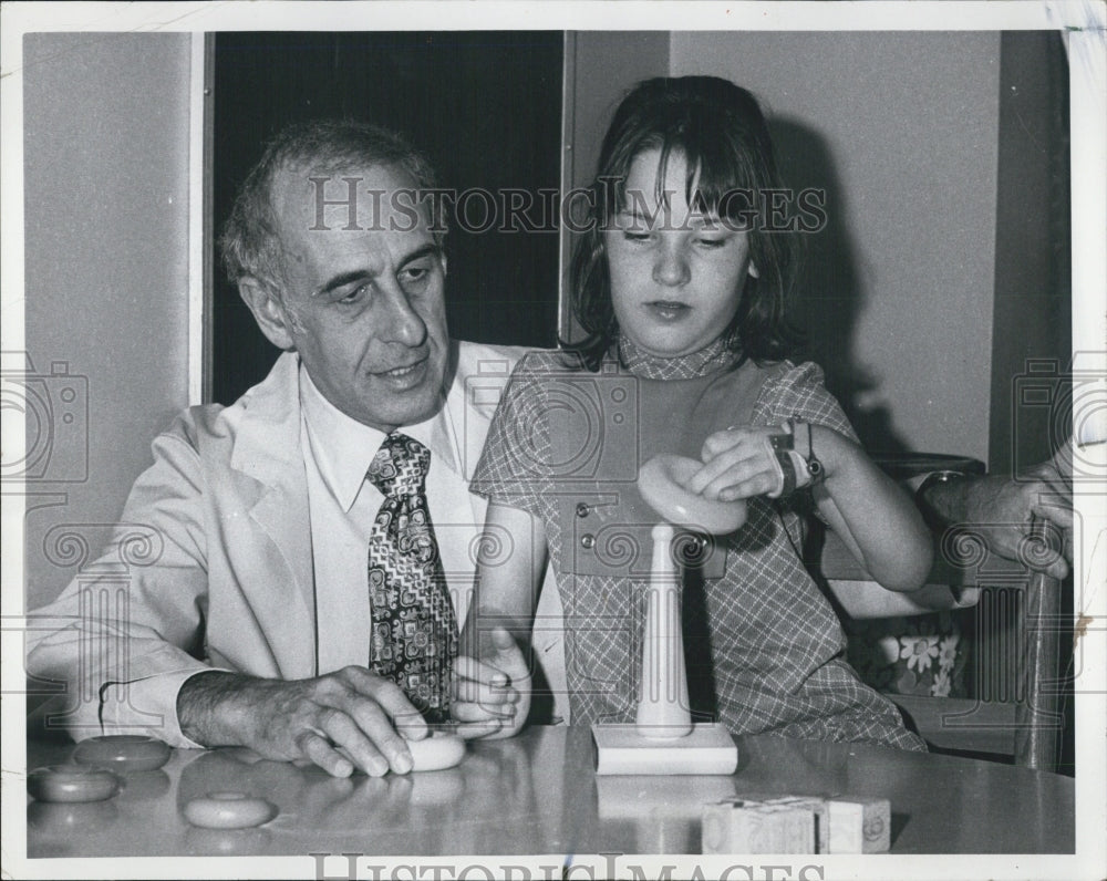 1975 Dr Aaron Rosenthal Works with Child with Cerebral Palsy - Historic Images