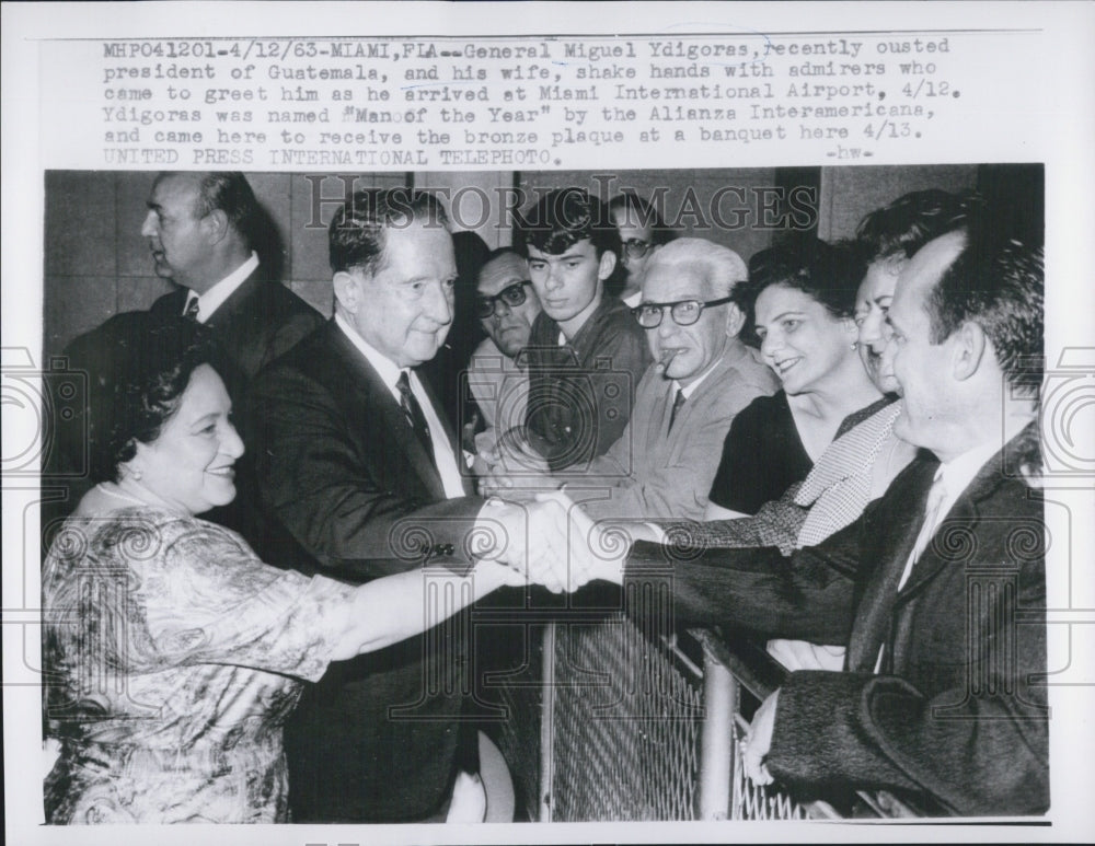 1963 Gen. Miguel Ydigoras and his wife shake hands with admirers. - Historic Images