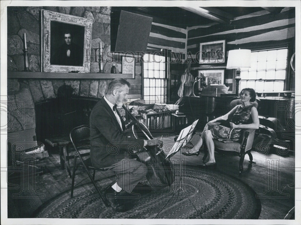 1969 Musician Everett Millard Playing For Wife Inside Log Cabin - Historic Images