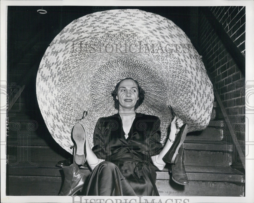 1951 of Mrs. Edwin R. Moore wearing hat w/shoes attached - Historic Images