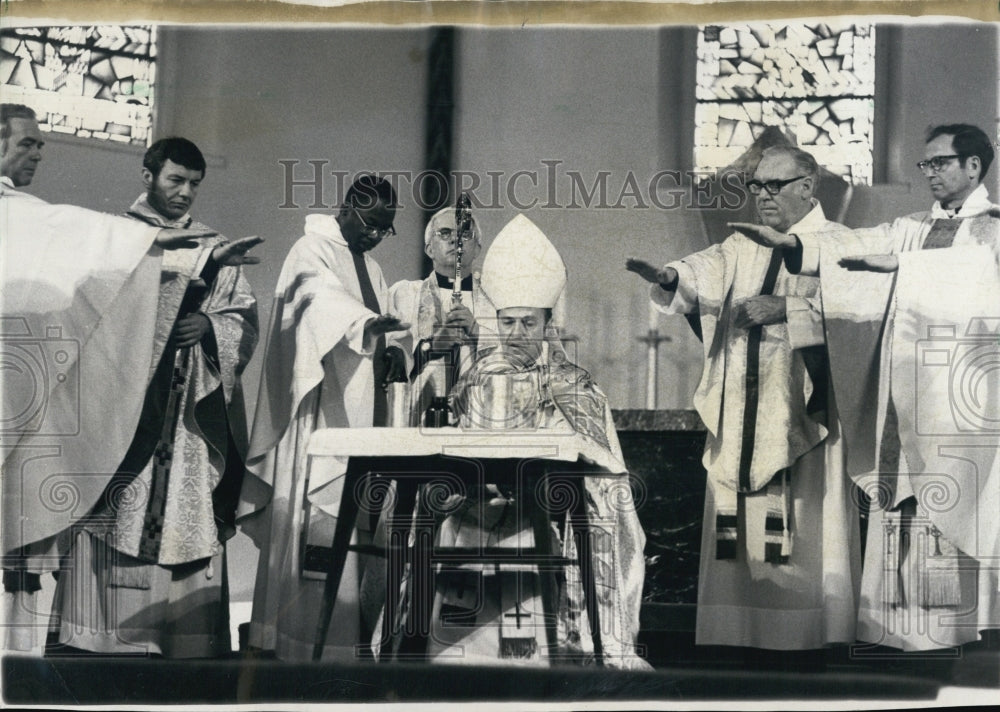 1973 Rt. Rev. James W. Montgomery blesses the oils - Historic Images