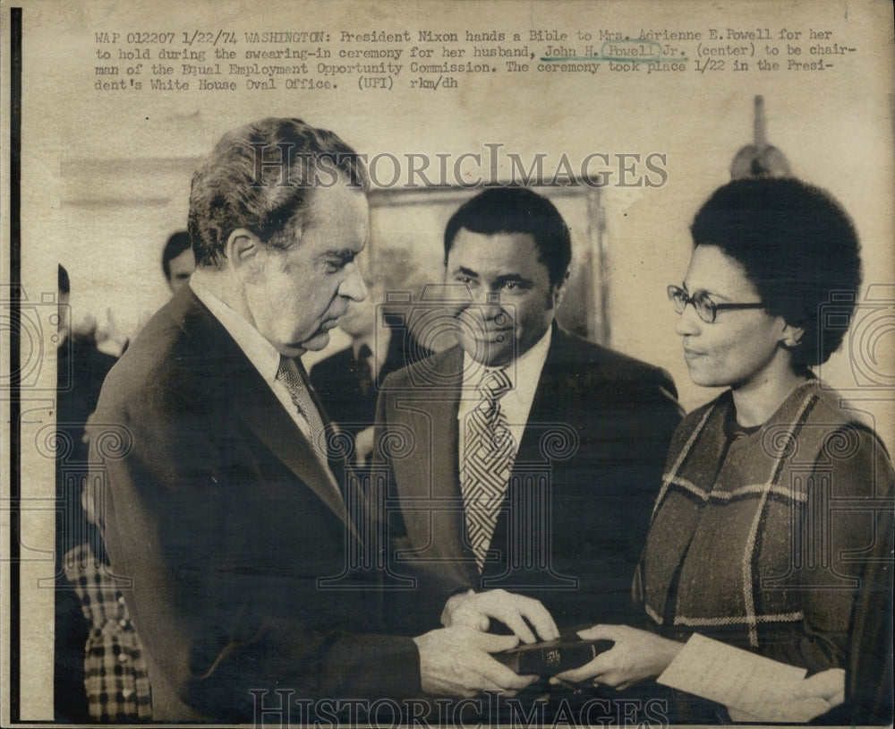 1974 President Nixon hands a bible to Mrs. Adrienne E Powell for her - Historic Images