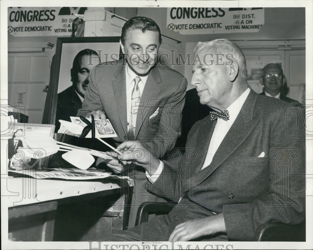 1958 Roman Puchinski talks with Sen. Paul Douglas. - Historic Images