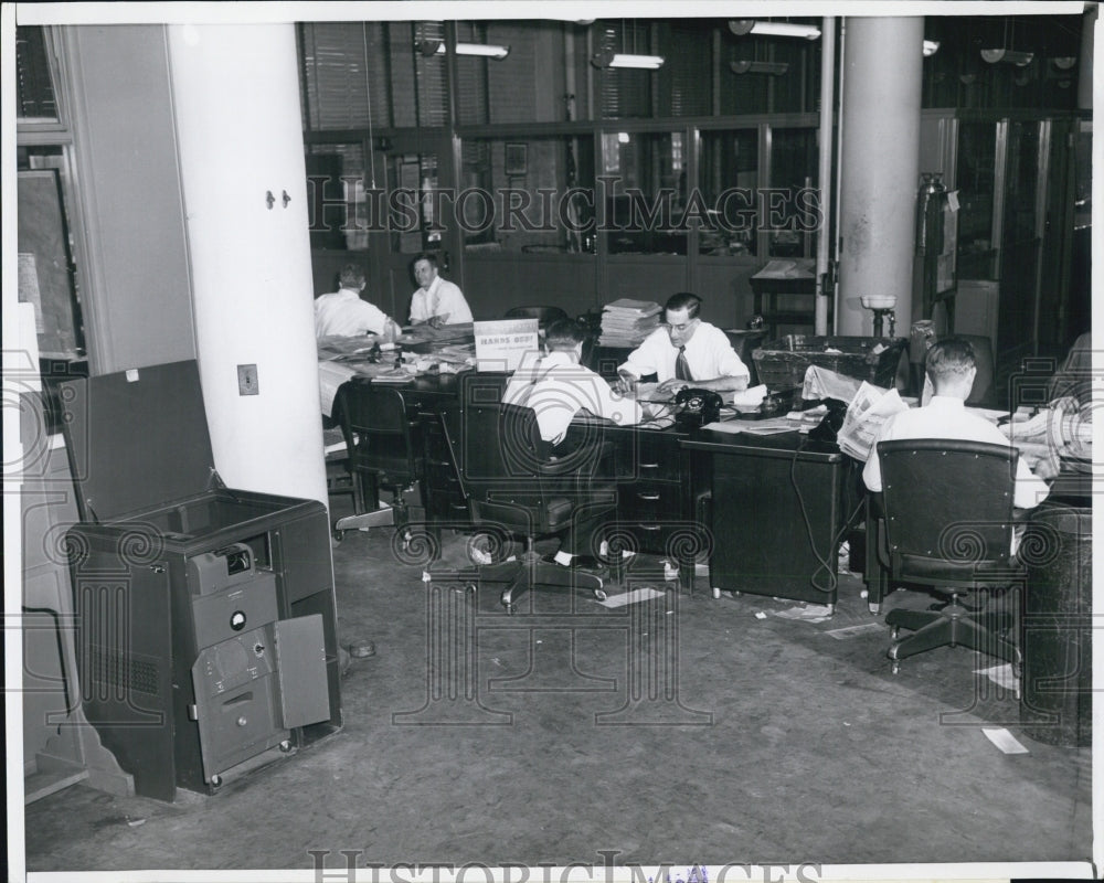 Press Photo Men working with telephones at their seats - Historic Images