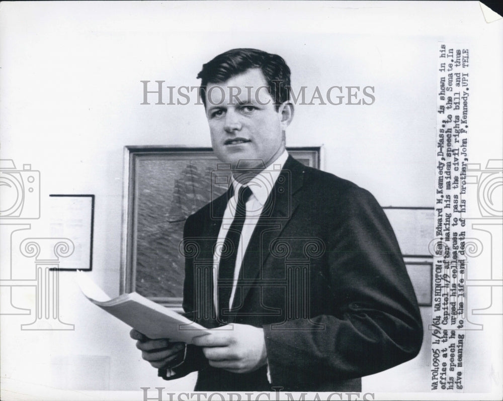 1964 Sen. Ted Kennedy holding a stack of papers - Historic Images