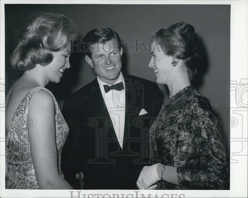 1963 Edward Kennedy and wife Joan chat with Mrs John Culver - Historic Images