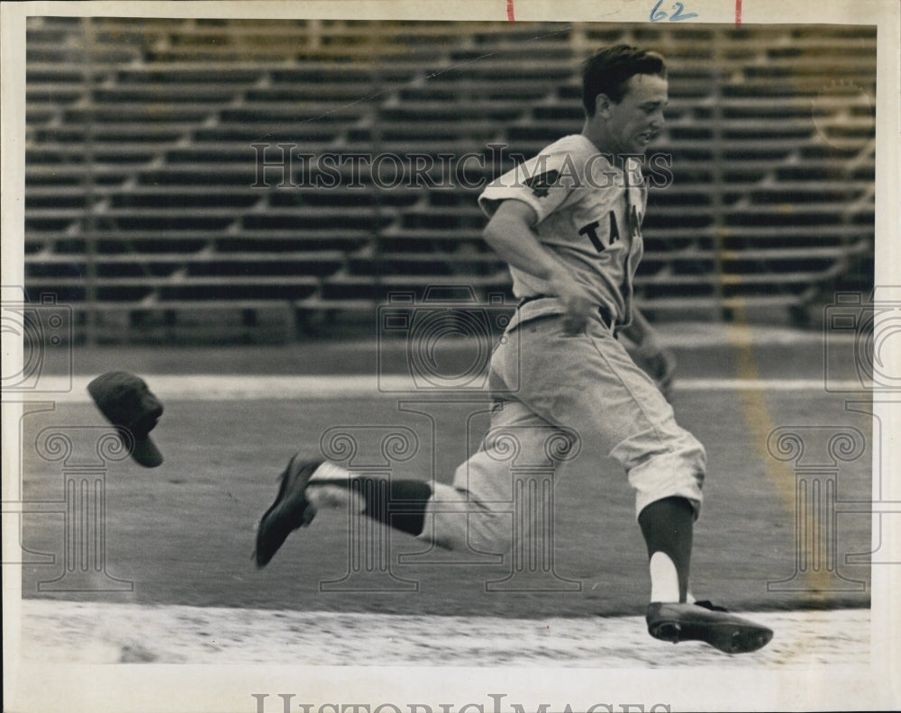 1964 Ron Robinson rounds third base on the way to score on a single. - Historic Images