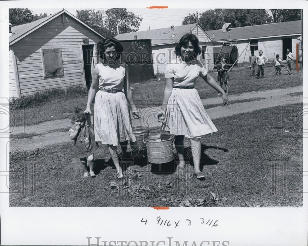 1965 Migratory Workers Women Child Buckets Homes - Historic Images