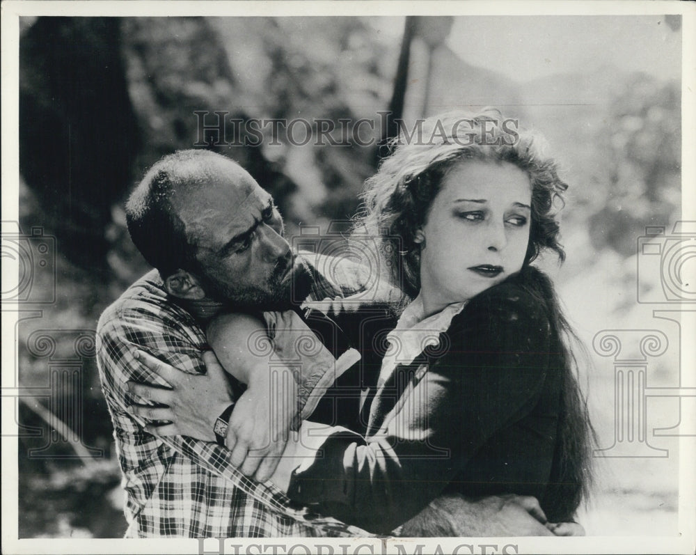 1934 an actress in an actor's embrace in a movie - Historic Images