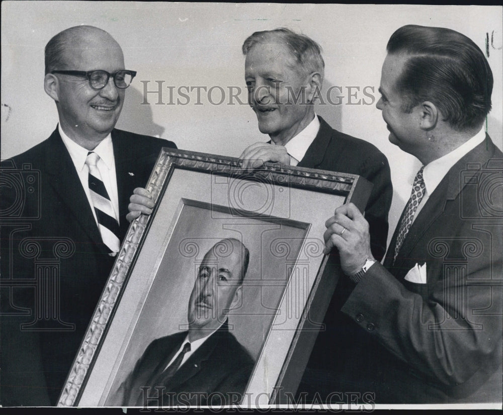 1967 Dr. Noble J. Puffer, with a portrait of himself. - Historic Images