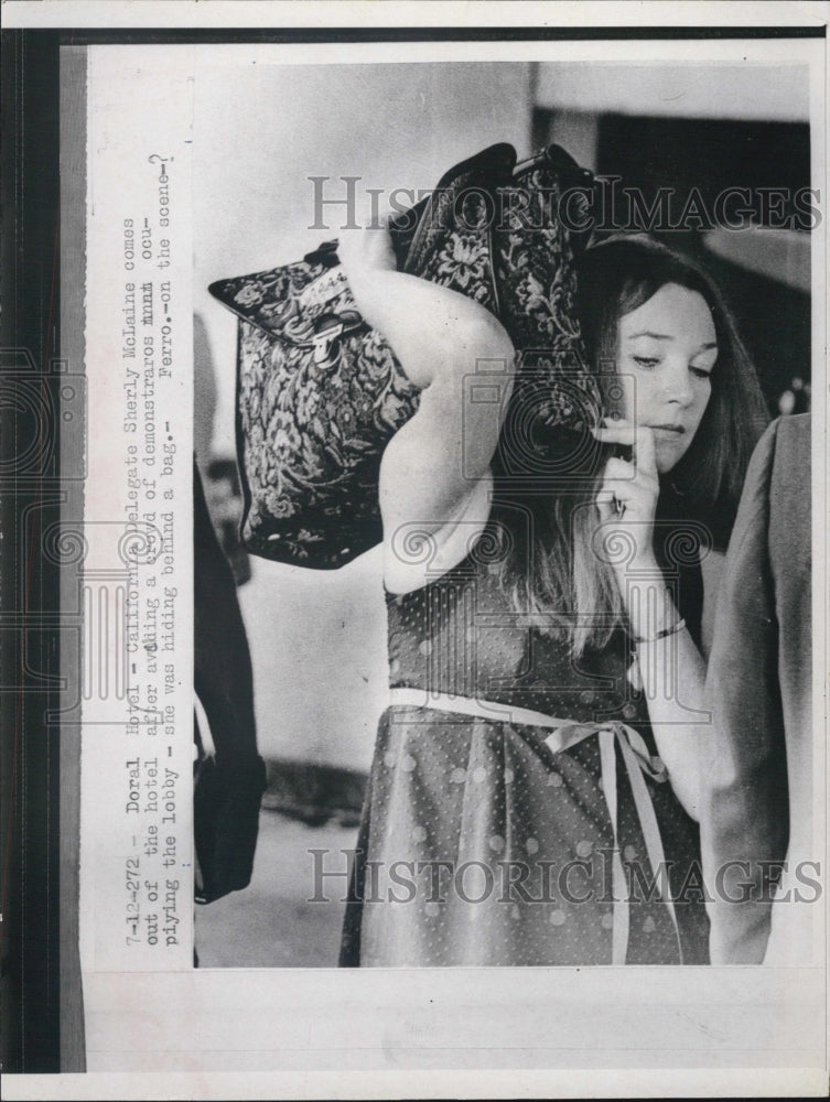 1972 Shirley MacLaine slips past Protesters - Historic Images