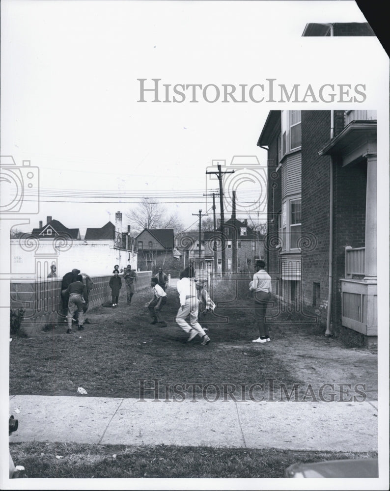 1965 Kids playing Football Michigan Detroit - Historic Images