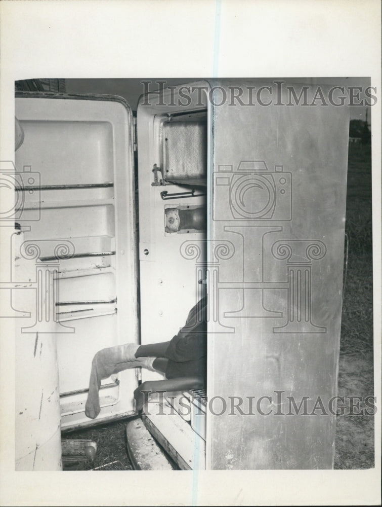 1967 Ice box Refrigerator abandoned appliance with child inside - Historic Images