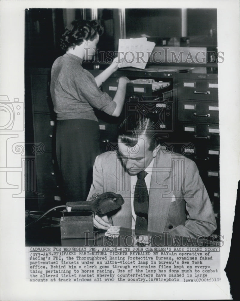 1953 Operative Of FBI Racing Bureau Examines Fake Ticket - Historic Images