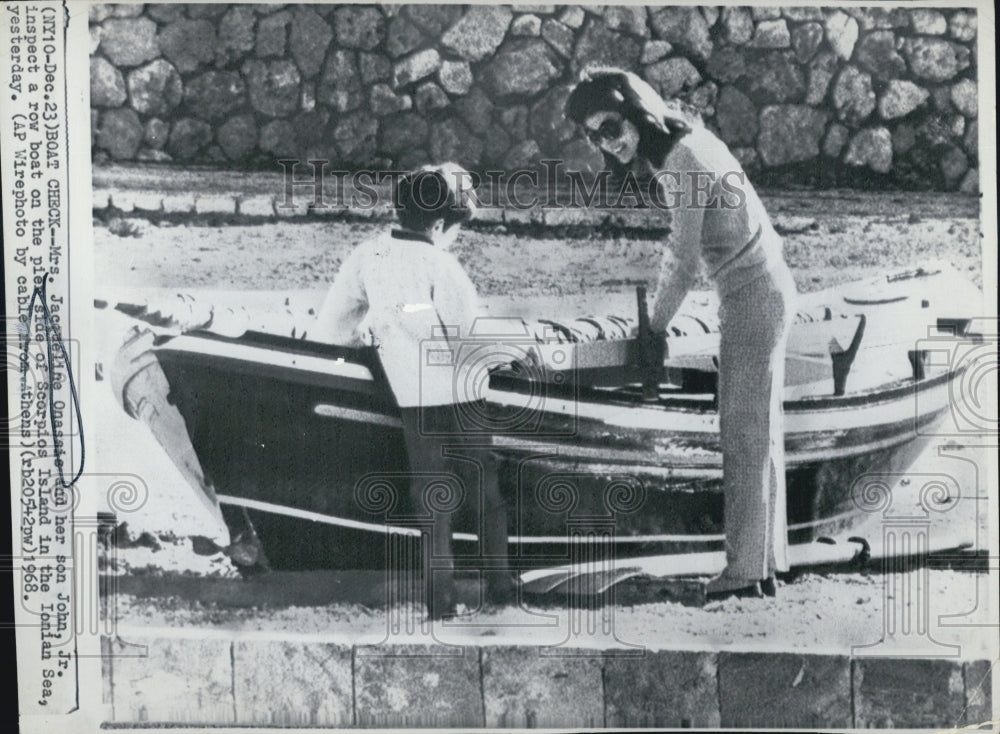 1968 Jacqueline Onassie &amp; Son Look Over Rowboat in Scorpios Islands - Historic Images