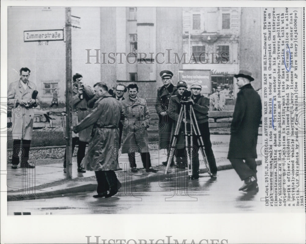 1961 Howard Trivers in East Berlin to talk to Soviet officer - Historic Images