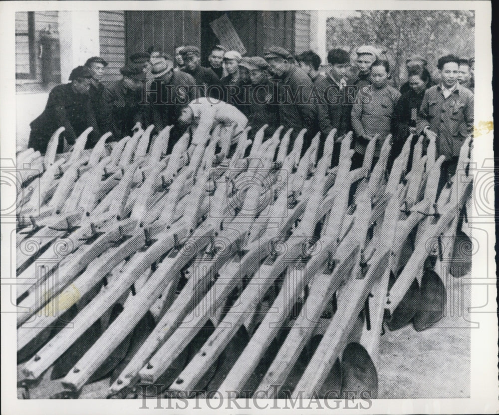 1955 Press Photo of peasants looking at tools from Canton Farm Tool factory - Historic Images