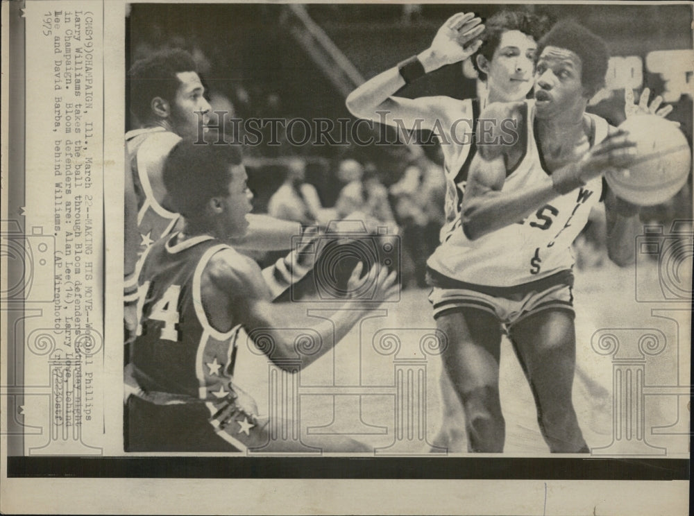 1975Wendell Phillips and Larry Williams takes the ball 
Phillips HS - Historic Images