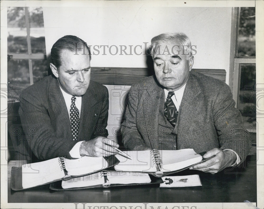 1952 Two Men Looking Over Appointment Books - Historic Images