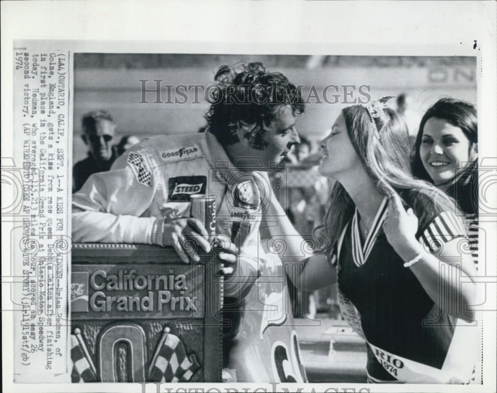 1974 California Grand Prix Brian Redman kissed by Debbie Calton - Historic Images